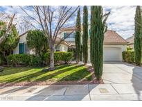 Charming home featuring a lush green lawn and well-manicured bushes at 916 Granger Farm Way, Las Vegas, NV 89145