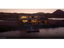 Beautiful modern waterfront home featuring a private dock with seating area for relaxing at 1572 Pleasant Bay Ct, Henderson, NV 89011