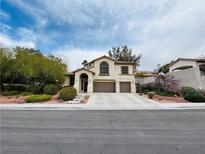 Charming two-story home with a well-manicured lawn and a three-car garage, located in a friendly neighborhood at 3047 Whispering Crest Dr, Henderson, NV 89052