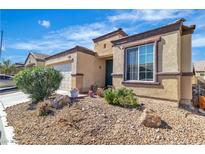 Charming single-story home with desert landscaping and a two-car garage in a residential neighborhood at 3335 Wasatch Cedars St, Las Vegas, NV 89122