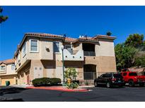 Inviting multi-level home with a red-tiled roof, convenient parking, and neat landscaping at 650 Sandy Beach Way # 0, Boulder City, NV 89005