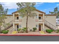 A charming multi-Gathering home featuring two stories with balconies and well-maintained landscaping at 1830 N Buffalo Dr # 1029, Las Vegas, NV 89128