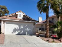 Charming single-Gathering home featuring a two-car garage, tile roof, and well-maintained landscaping at 1836 Misty Glade Dr, Las Vegas, NV 89119