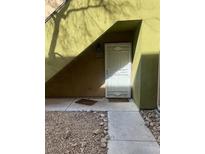 Exterior front door with security screen on a home with gravel landscaping at 1842 N Decatur Blvd # 101, Las Vegas, NV 89108