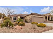 Charming single-story home featuring desert landscaping, a spacious two-car garage, and a well-maintained lawn at 2832 Goldcreek St, Henderson, NV 89052