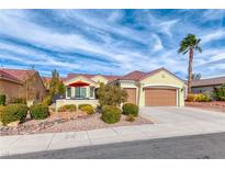 Charming single-story home featuring a tile roof, mature landscaping, and a two-car garage at 3032 Stratmoor Hills Ave, Henderson, NV 89052
