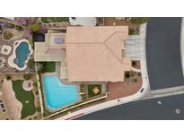 Stunning aerial view of backyard with a pool, ping pong table, and outdoor seating at 4105 Falcons Flight Ave, North Las Vegas, NV 89084