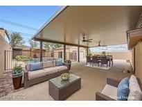 Spacious covered patio with comfortable seating, dining area, and access to a pool at 442 Republic St, Henderson, NV 89015