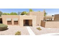 Charming single-story home featuring a stone-accented entrance and desert landscaping at 4304 Gretna Green Ct, Las Vegas, NV 89110