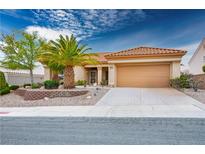 Charming single-story home featuring desert landscaping, a spacious driveway, and a two-car garage at 10401 Sea Palms Ave, Las Vegas, NV 89134