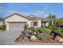 Charming single-story home with a well-manicured front yard and a two-car garage at 2804 Gallant Hills Dr, Las Vegas, NV 89135