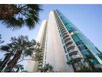 Stunning high-rise exterior featuring modern architecture, private balconies, and lush palm trees at 322 Karen Ave # 3407, Las Vegas, NV 89109