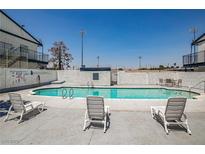 Inviting community pool with lounge chairs for relaxing in the sun at 4600 University Center Dr # 99, Las Vegas, NV 89119