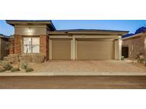 Charming single-story home with a two-car garage and brick driveway in a well-maintained neighborhood at 463 Harmony Bay Ave, Las Vegas, NV 89138