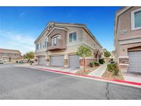 Charming multi-level townhouse featuring a private balcony and attached two-car garage at 5537 Parlay Way # 101, Las Vegas, NV 89122