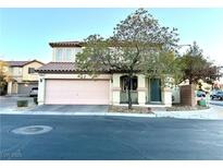 Charming two-story home with a two-car garage and desert landscaping at 6087 Devers Ct, Las Vegas, NV 89118