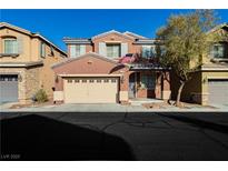 Charming two-story home featuring a spacious two-car garage and well-maintained front yard at 7214 Regent Pond St, Las Vegas, NV 89166