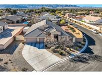 Beautiful single-story home featuring a two-car garage, landscaped yard, and mountain views at 7711 Gracemoor Ct, Las Vegas, NV 89149