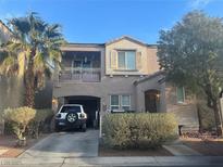Charming two-story home features a covered entryway, balcony, and attached garage at 9078 Hilverson Ave, Las Vegas, NV 89148