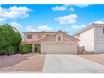 Charming home with a two-car garage, neutral paint, and well-manicured shrubs at 943 Sedona Rd, Henderson, NV 89014