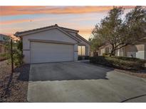 Charming single-story home with a two-car garage and desert landscaping at 10971 Civiletti St, Las Vegas, NV 89141