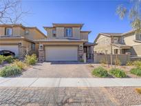 Charming two-story home with a two-car garage and inviting curb appeal at 205 Rondeau Ave, Henderson, NV 89011