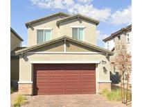Charming two-story home featuring a two-car garage and neutral-toned exterior at 214 Vanhoy Ave, Henderson, NV 89011