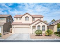 Charming two-story home with a desert landscaped front yard and a two-car garage at 2222 Heavenly Lights Ave, Las Vegas, NV 89123