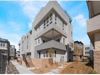 Modern townhome featuring clean lines, large windows, and a welcoming entrance at 2509 Silent View Ave, Henderson, NV 89044