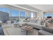 Bright living room boasts city views, modern furnishings and comfortable seating arrangements at 2700 Las Vegas Blvd # 1202, Las Vegas, NV 89109