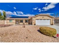 Charming single-story home with a low maintenance rock yard and solar panels at 4910 Marywood Ct, Pahrump, NV 89061