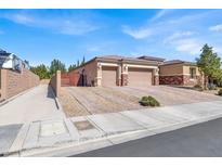 Spacious single-story home features a three-car garage, a private entry gate and low maintenance landscaping at 7420 Zonal Ave, Las Vegas, NV 89131