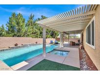 Inviting backyard pool and spa with a covered patio, perfect for outdoor relaxation and entertaining at 7420 Zonal Ave, Las Vegas, NV 89131