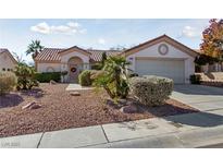 Charming single-story home featuring a tile roof, gravel yard, and well-maintained landscaping at 10033 Cresent Creek Dr, Las Vegas, NV 89134