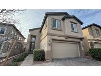 Two-story home features a 2-car garage, neutral paint, manicured landscaping, and a welcoming front entrance at 10075 Cranbrook Falls Ct, Las Vegas, NV 89148