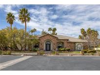 Beautiful single story home with manicured yard, desert landscaping, and stone accents at 1901 Rosemere Ct, Las Vegas, NV 89117