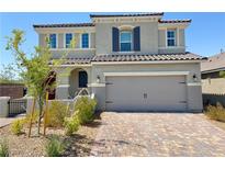Beautiful two-story home with a brick driveway and a large two car garage at 2629 Monte Cevedale St, Henderson, NV 89044
