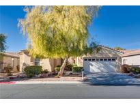 Charming single-story home with a well-manicured front yard and a two-car garage at 4705 Bersaglio St, Las Vegas, NV 89135