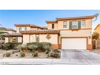 Beautiful two-story home with a two-car garage, desert landscaping, and a classic tile roof at 7293 Iron Oak Ave, Las Vegas, NV 89113