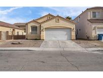 Charming single-story home with a two-car garage and desert landscaping at 9604 Flying Eagle Ln, Las Vegas, NV 89123