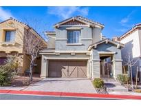 Charming two-story home with a two-car garage and manicured front yard at 11242 Almador Vista Ct, Las Vegas, NV 89135