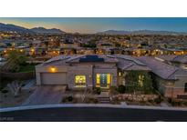 Beautiful single-story home featuring a modern design, professional landscaping, and a three car garage at 10086 Amethyst Hills St, Las Vegas, NV 89148