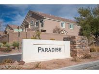 The community sign that reads Paradise is in front of the homes at 1066 Slate Crossing Ln # 3, Henderson, NV 89002