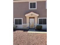 Inviting home entrance with a security screen door and well-maintained landscape at 1066 Slate Crossing Ln # 3, Henderson, NV 89002