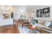 Comfortable living room with stylish decor, wood floors, a modern sofa, and a unique wood coffee table at 3044 Casey Dr # 101, Las Vegas, NV 89120