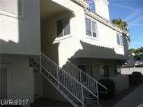A bright exterior view of a two-story home with white siding and white trim at 833 Aspen Peak Loop # 2614, Henderson, NV 89011