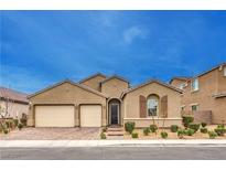 Charming single-story home featuring a two-car garage and desert landscaping at 8841 White Harbor Ave, Las Vegas, NV 89148