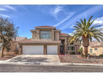 Inviting two-story home featuring a three-car garage, mature landscaping and a beautiful palm tree at 8953 Belconte Ln, Henderson, NV 89074