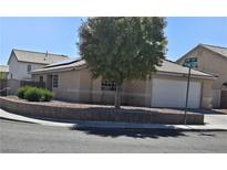 Charming single-story home featuring a two-car garage, desert landscaping, and a tile roof at 1079 African Eagle Ave, Henderson, NV 89015