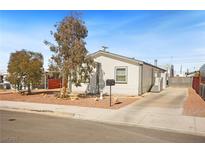 Charming single-story home with a well-maintained yard and long concrete driveway at 274 Aztec Ln, Henderson, NV 89015